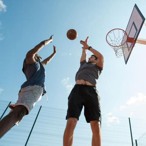 basketball players in mid-shot