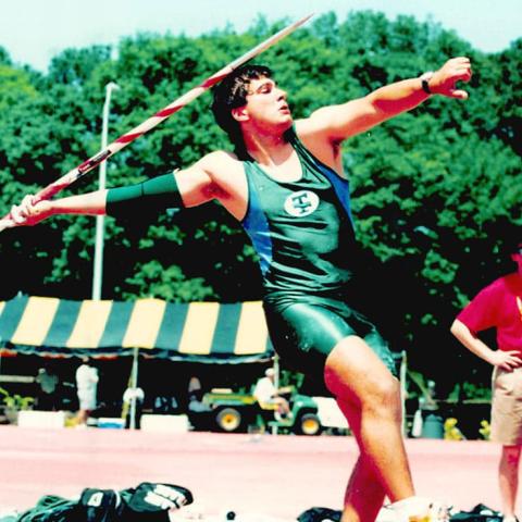 male athlete throwing javelin
